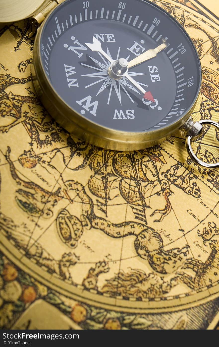 A beautiful golden compass on a background