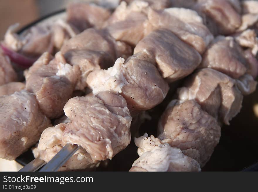 Pork shish kebab on skewers before preparation