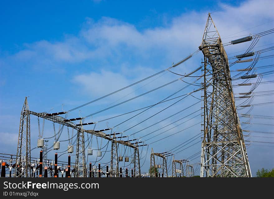 High voltage pylons, transformer and insulators, electrical distribution, overhead line. High voltage pylons, transformer and insulators, electrical distribution, overhead line