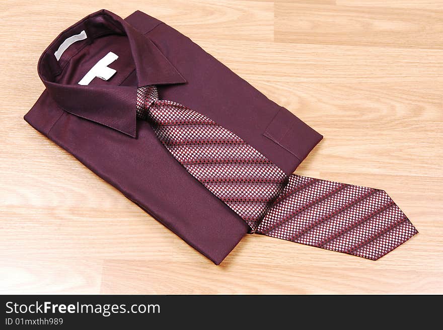 Burgundy dress shirt with tie.