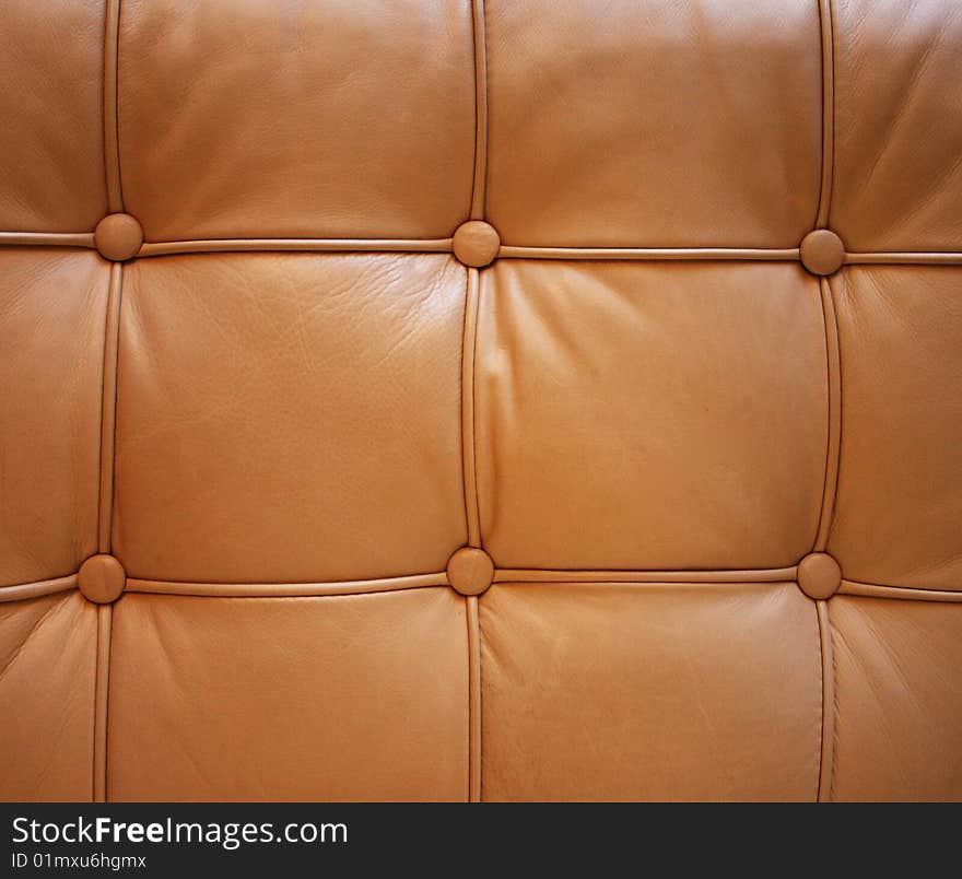 Square tuck pattern on a leather sofa. Square tuck pattern on a leather sofa.