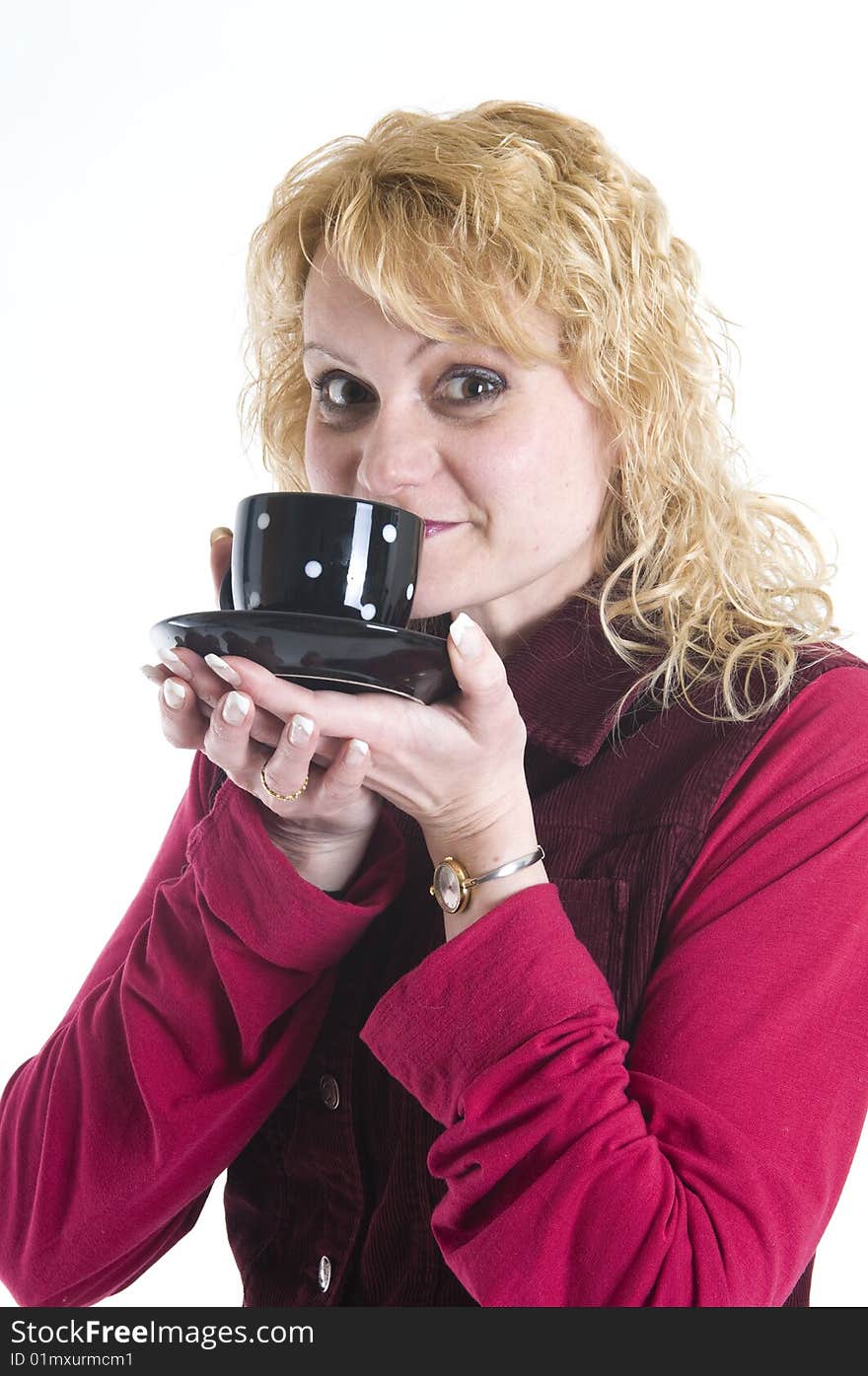 A beautiful woman is drinking coffee out of mugs in black. A beautiful woman is drinking coffee out of mugs in black