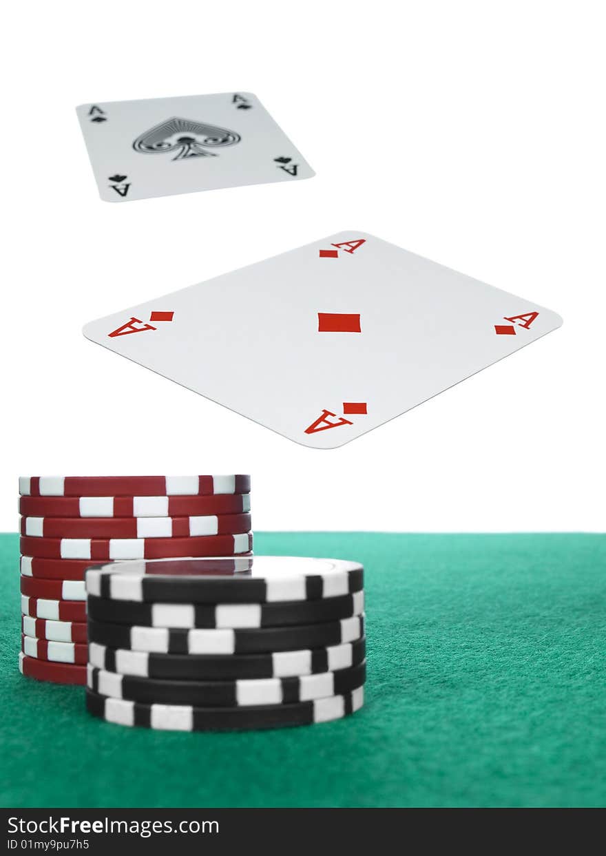 Two aces flying over the poker table. Red and black chips on the foreground. Two aces flying over the poker table. Red and black chips on the foreground.