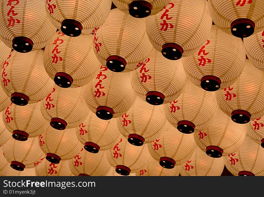 A ceiling of lanterns hanging outside a restaurant in Japan. A ceiling of lanterns hanging outside a restaurant in Japan