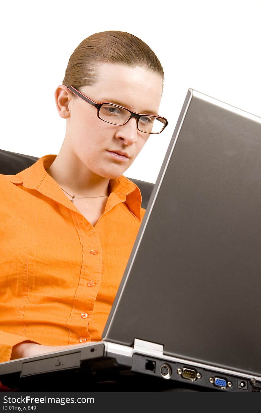 Young woman working on laptop on white ground