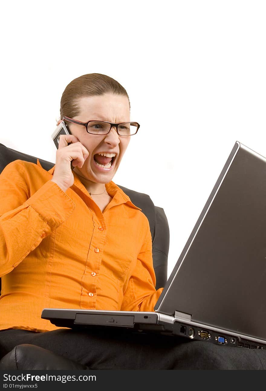 Young woman screaming at laptop