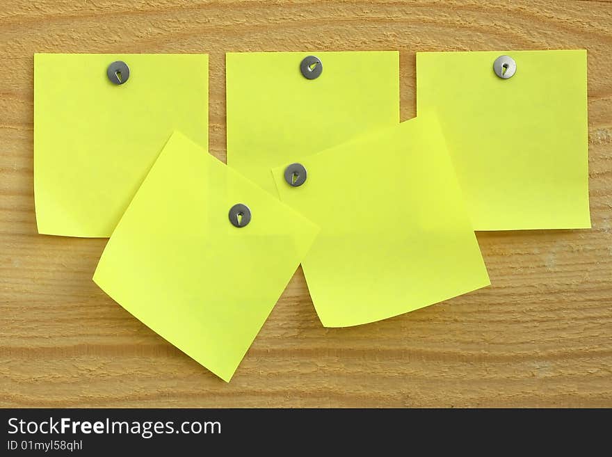 Blank paper reminders on wood surface