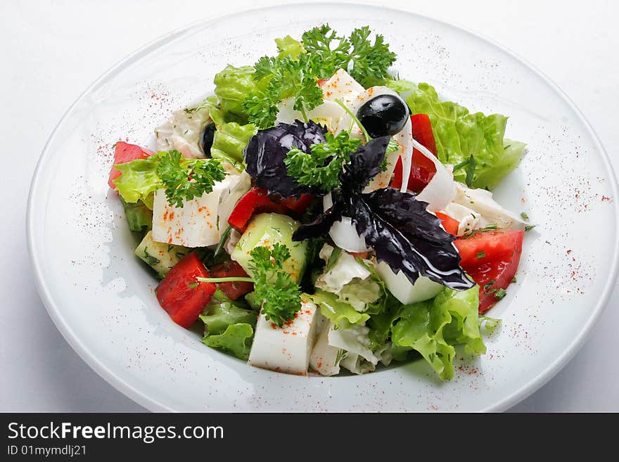 Greek lettuce on a white dish. Greek lettuce on a white dish.