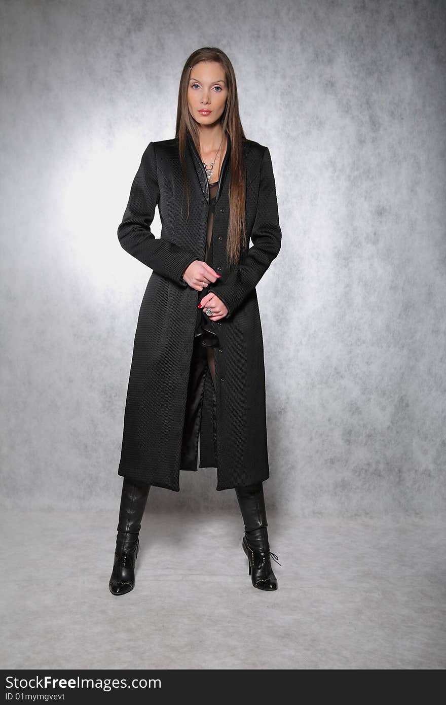 Woman in a coat posing