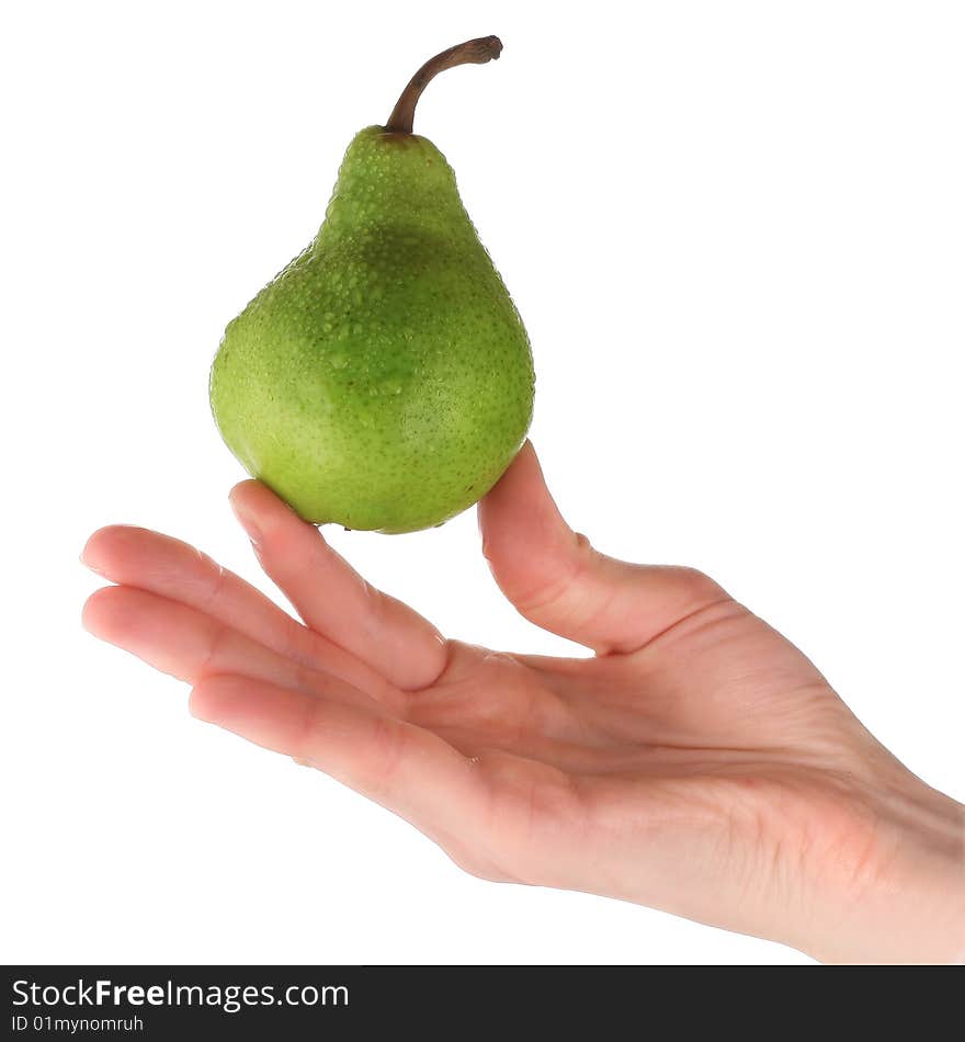 Green pear in hand isolated on white