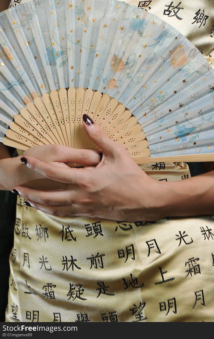 Woman Holding a Fan