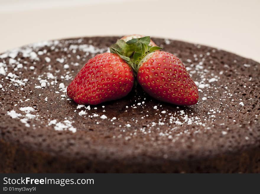 Chocolate mud cake topped with strawberries