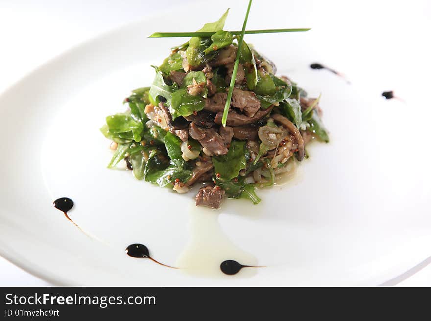 Vegetable salad with meat on a plate