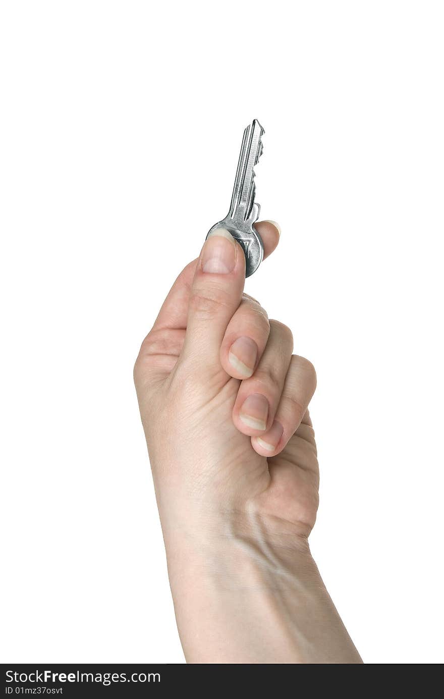 Silver key in a female hand