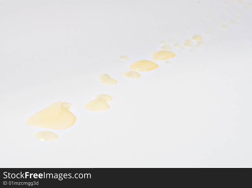 Yellow drops on a white background