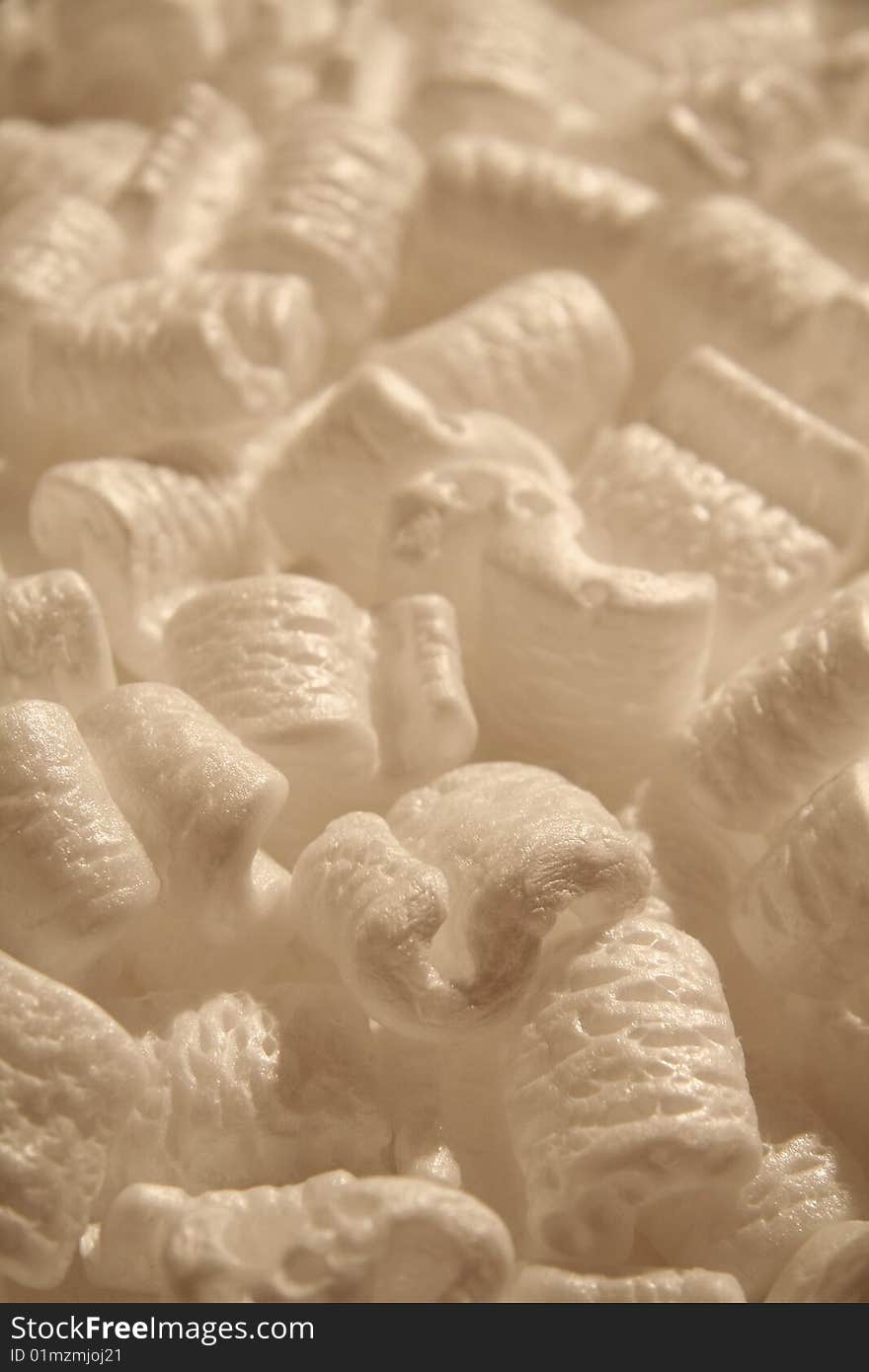 Several brown styrofoam packing peanuts close up shot. Several brown styrofoam packing peanuts close up shot