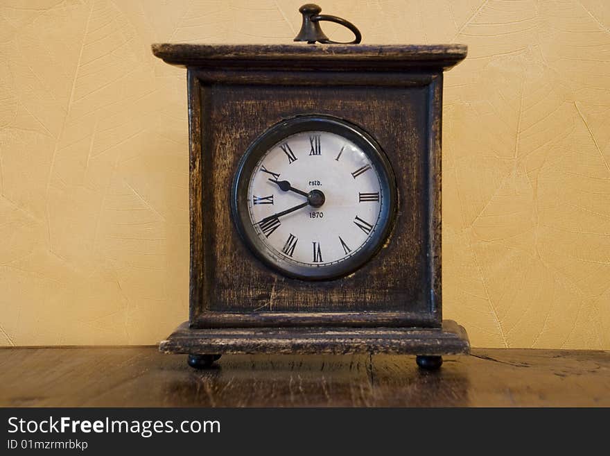 Vintage clock in front of the wall