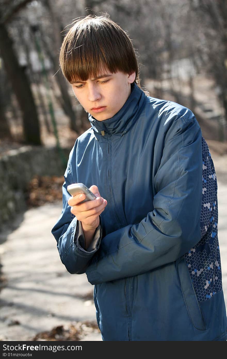 Teenager waiting for his dating in park. Teenager waiting for his dating in park