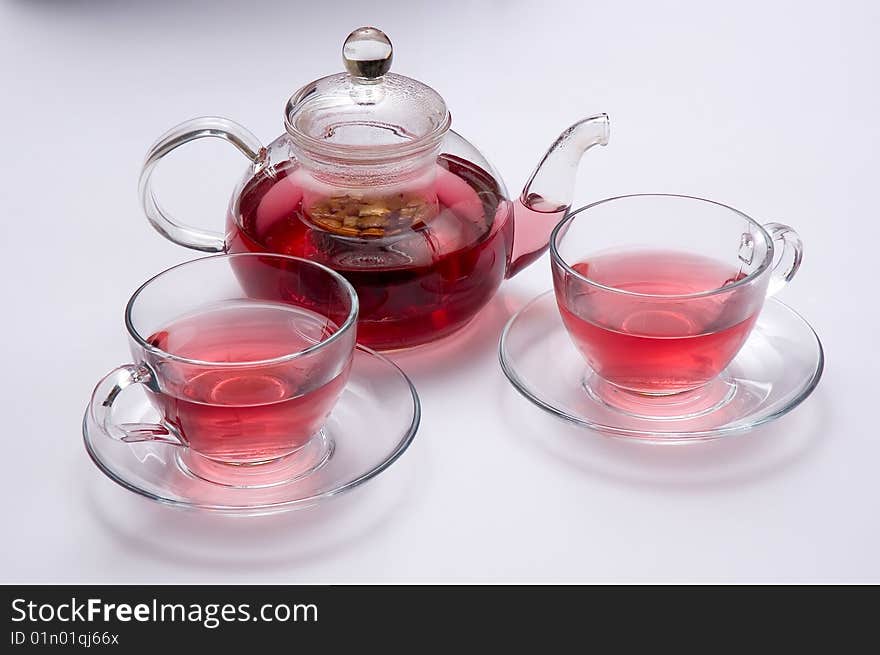 Glass teapot with fruit and two cups of tea. Glass teapot with fruit and two cups of tea