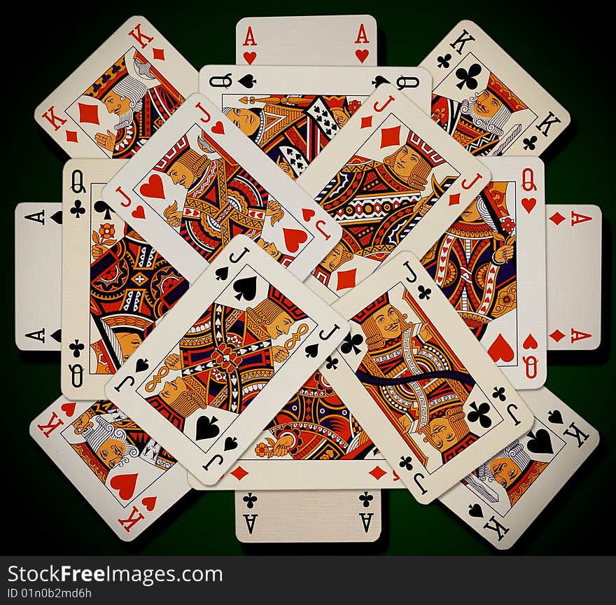 Playing cards on green background