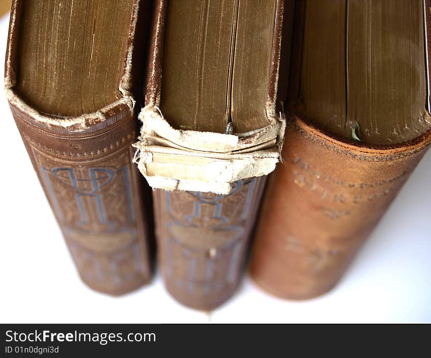 Three old books i a row