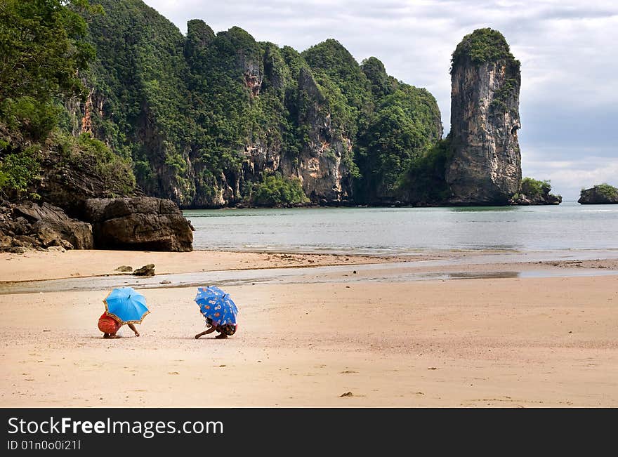 Two umbrellas at Ao Nang Beach, Thailand