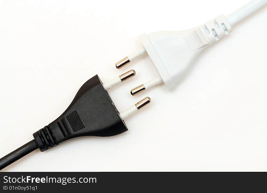 Black and white wires on a white background on the diagonal. Black and white wires on a white background on the diagonal