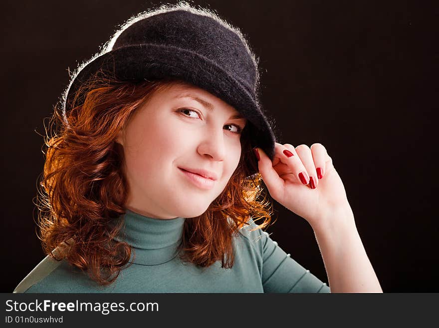 Young girl in black hat