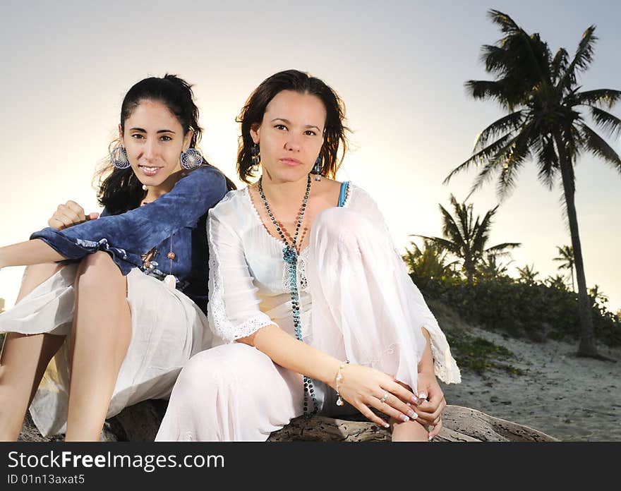Portrait of two fashion female models on tropical beach. Portrait of two fashion female models on tropical beach