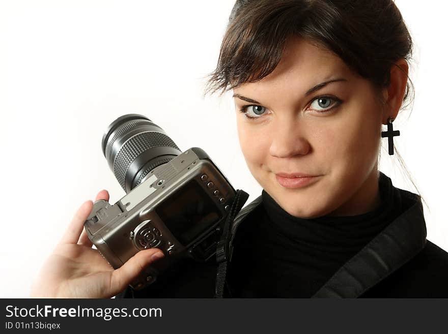 The beautiful girl with a camera on a white background