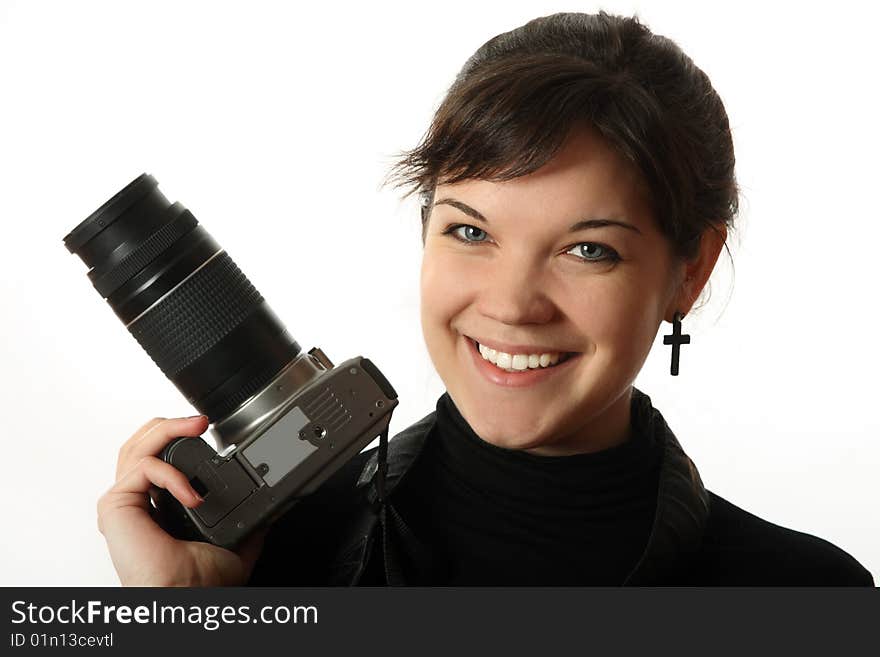 The beautiful girl with a camera on a white background