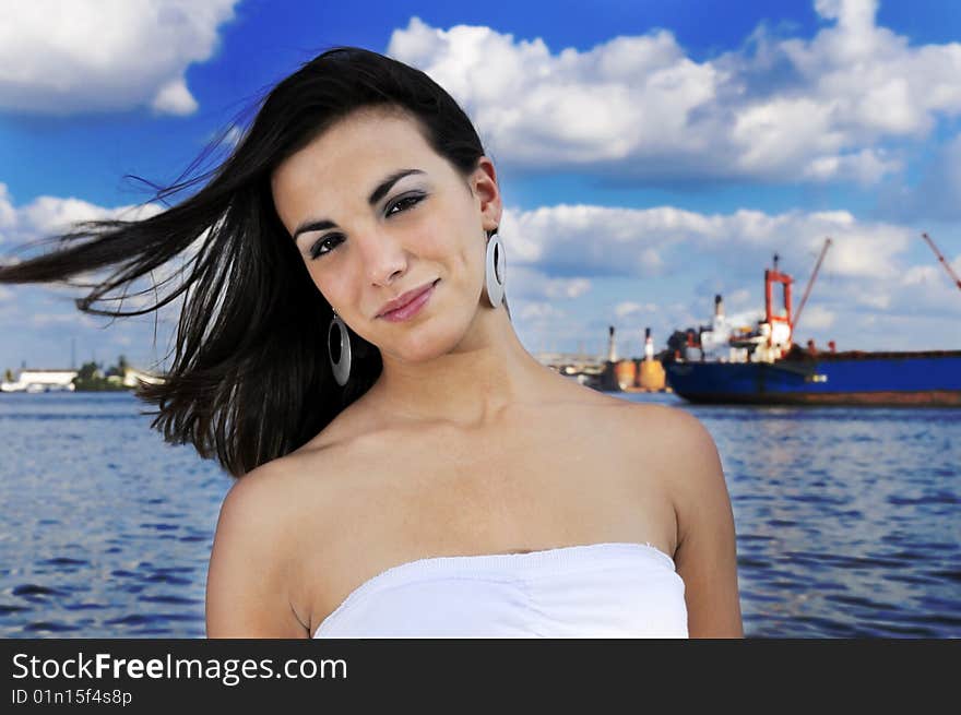 Portrait of natural teen girl posing on harbor background. Portrait of natural teen girl posing on harbor background