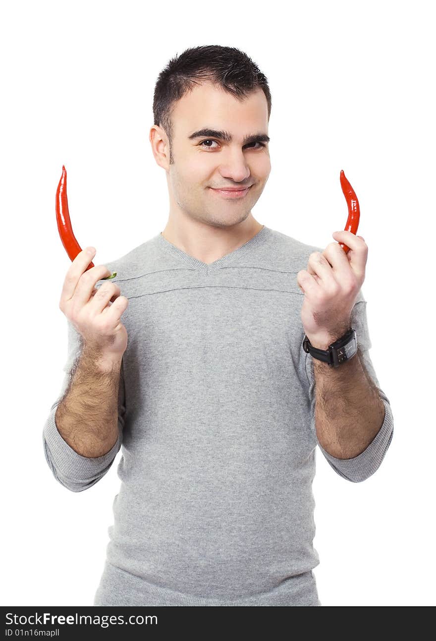 Portrait of a handsome man holding red hot chili peppers. Portrait of a handsome man holding red hot chili peppers