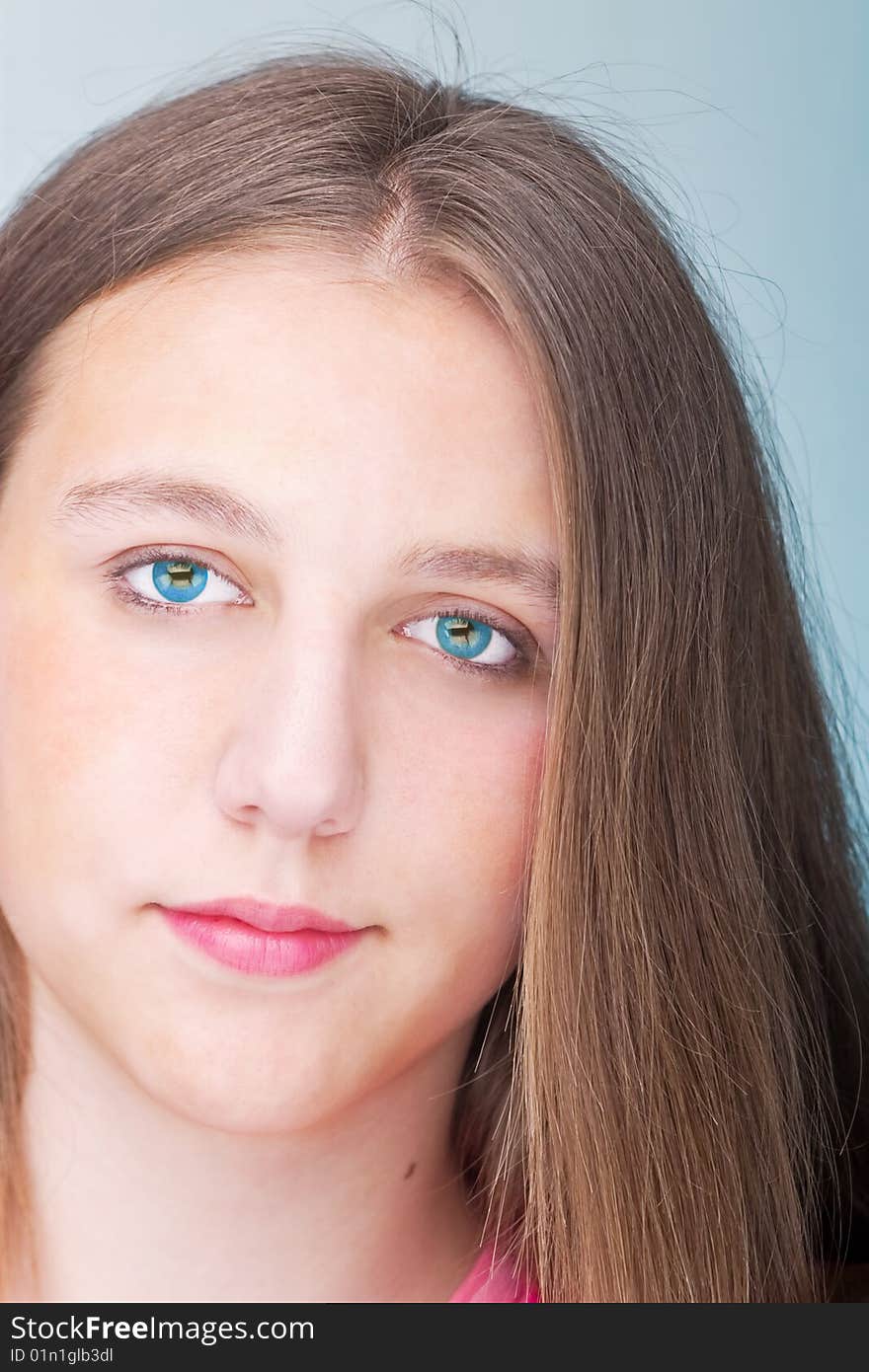 Teenage girl posing over blue background. Teenage girl posing over blue background