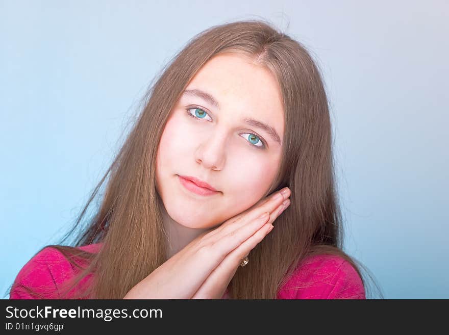 Teenage girl posing over blue background. Teenage girl posing over blue background