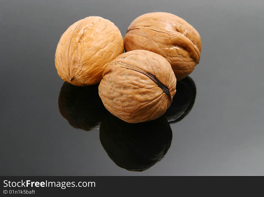 Three isolated walnut on white and black. Three isolated walnut on white and black