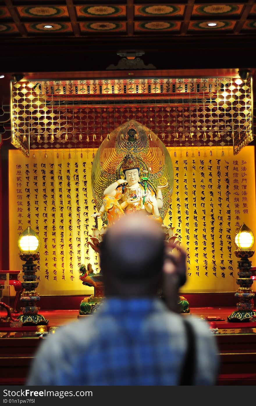 Bald Tourist Filing In A Chinese Buddhist Temple