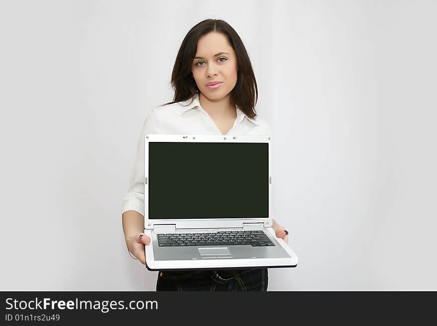 Pretty busines swoman holding laptop