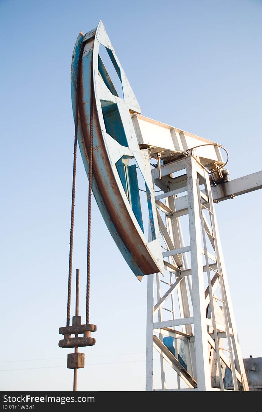 Oil pump on a background blue sky