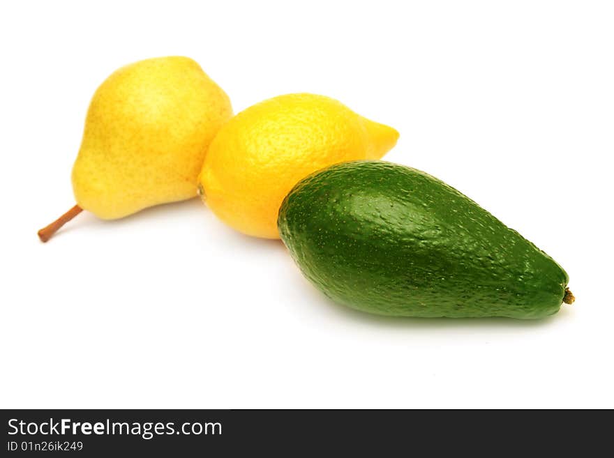 Pear,lemon and avocado isolated on white. Pear,lemon and avocado isolated on white.