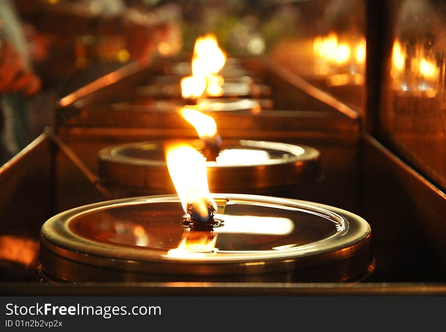 Oil lamp in a temple in Thailand. The lamp on the importance of religion One is faith. Oil lamp in a temple in Thailand. The lamp on the importance of religion One is faith.