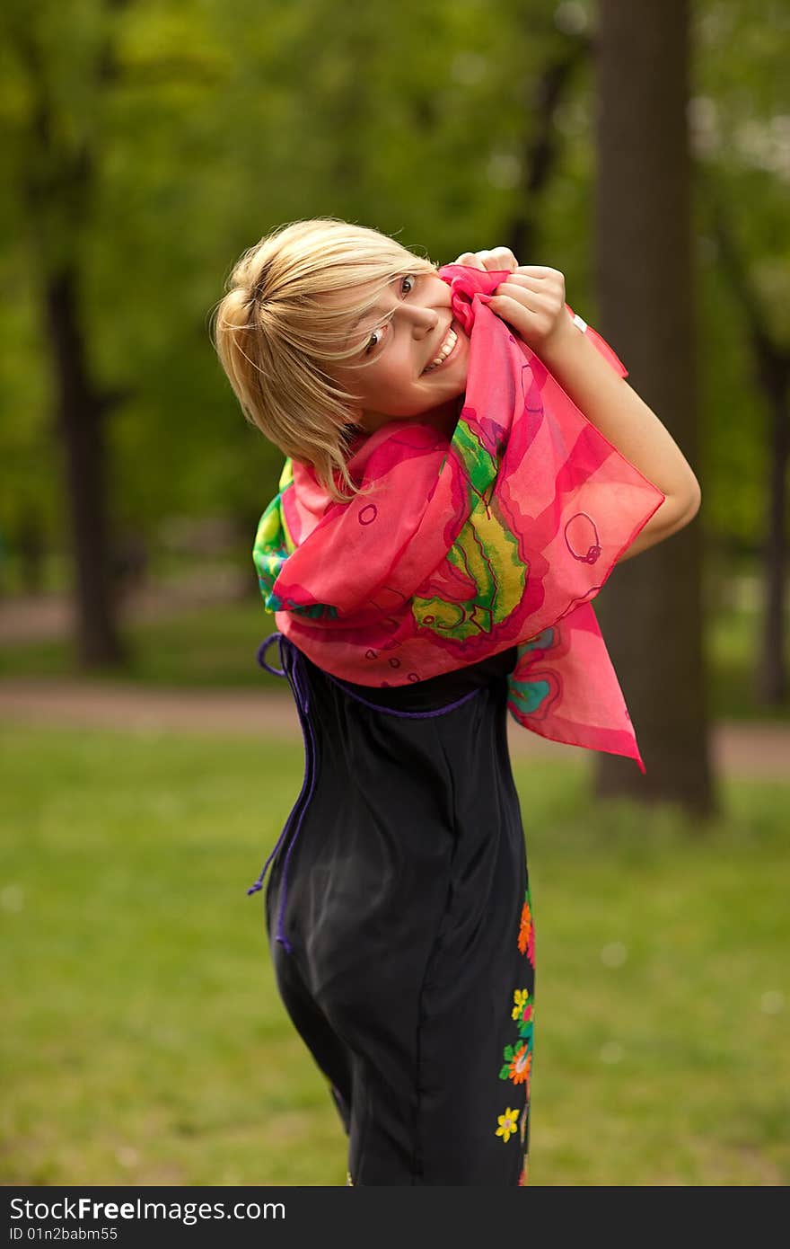 Young beautiful woman in the green park