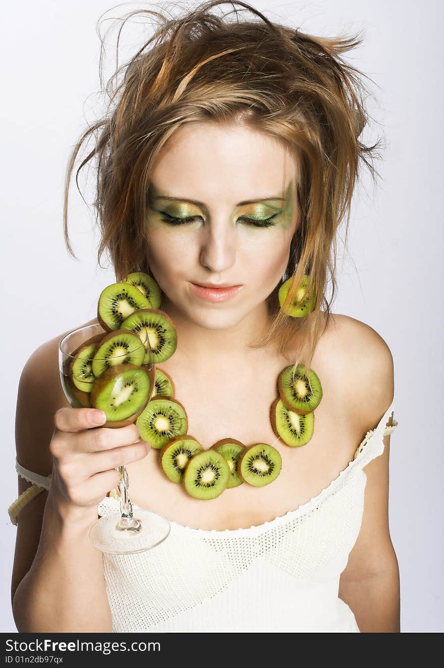 Portrait of young attractive woman with fruits