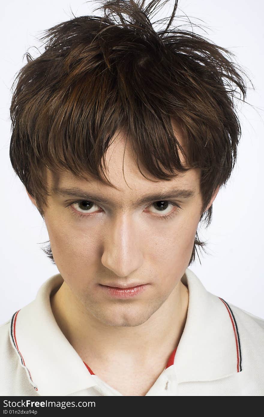 Portrait of young man in white shirt. Portrait of young man in white shirt