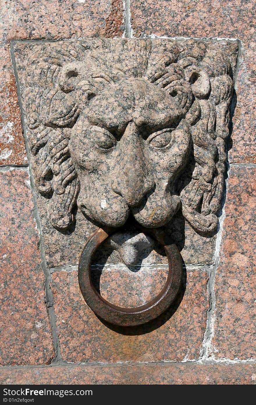 Lion head on Neva embankment in Saint-Petersburgh, Russia