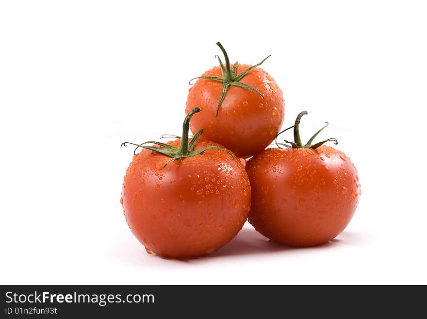 Red tomato on the white background