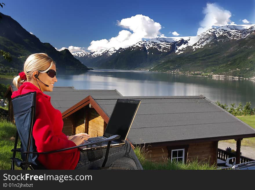 Woman Working On The Lake Shore