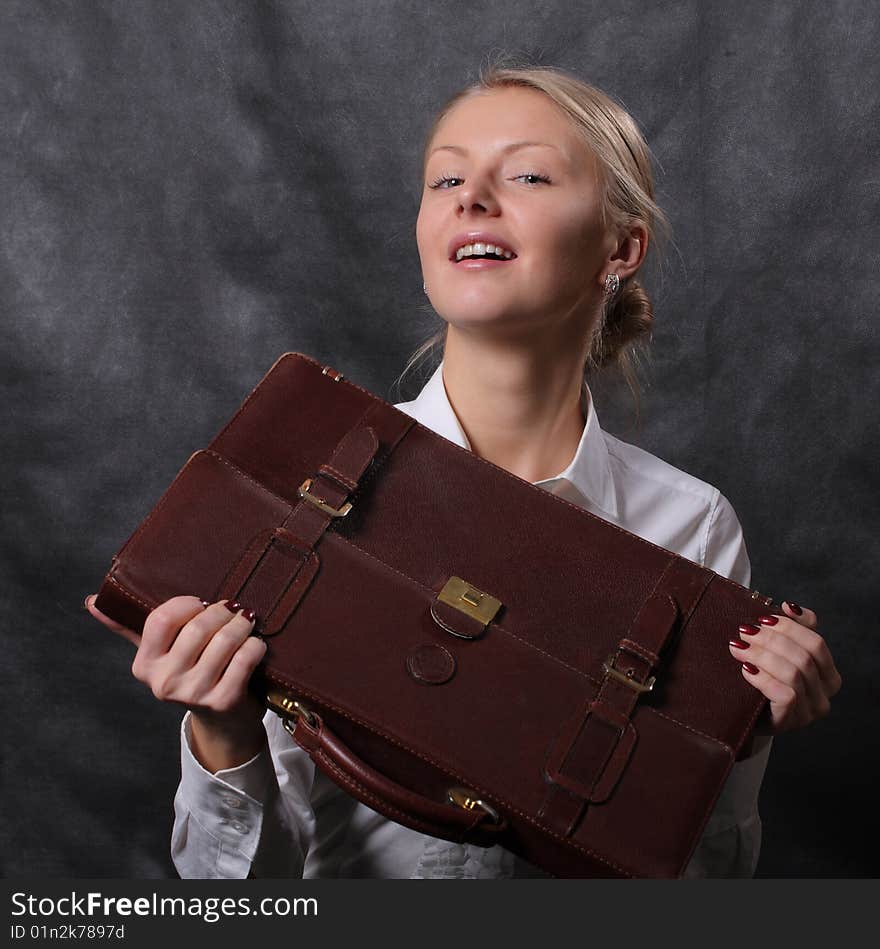 Woman holding brown leather briefcase. Woman holding brown leather briefcase