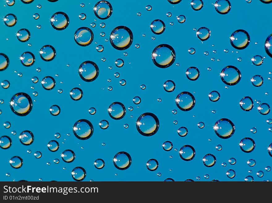 A lot of drops on blue background. A lot of drops on blue background