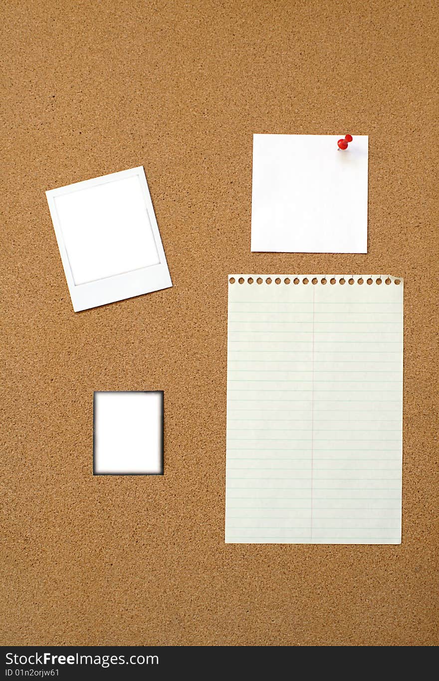 Lined paper, square note paper, polaroid  and transparency pinned on bulletin board. Lined paper, square note paper, polaroid  and transparency pinned on bulletin board